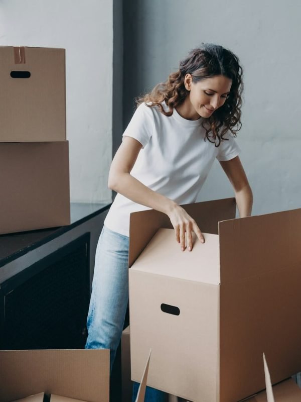 female-volunteer-packing-donation-box-for-refugees-looks-into-parcel-package-delivery-charity.jpg